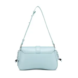 Detail of light blue leather baguette bag with side drawstring and silver hardware
