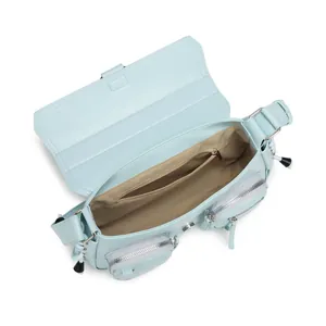Top view of open light blue baguette bag showing beige lining and interior zipper pocket