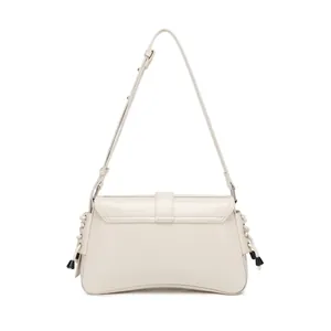 Macro view of cream white shoulder bag featuring a unique concave curved base and black beads