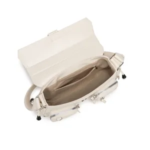 Top-down view of the cream shoulder bag interior with zippered compartment and matte faux leather