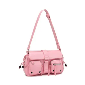 Detail of pink faux leather bag showing silver zippers and metallic ring buckles