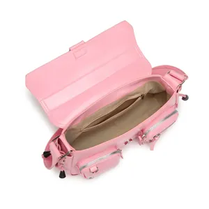 Pink glossy leather shoulder bag with open top showing internal compartments and side pockets
