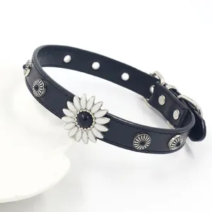 Detail of leather choker featuring white daisy flower ornament and metal studs