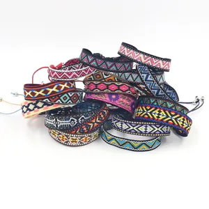 Ethnic bohemian woven friendship bracelets with colorful geometric patterns and tassels
