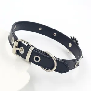 Macro shot of black leather choker with vintage metal studs and silver hardware buckle