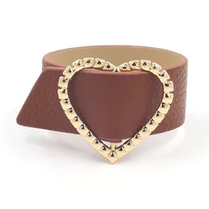 Brown PU leather wide bracelet featuring a gold heart clasp and rivet details