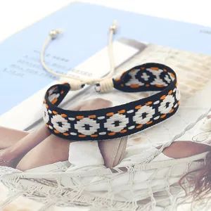 Detail of woven Bohemian bracelet featuring geometric patterns and adjustable closure
