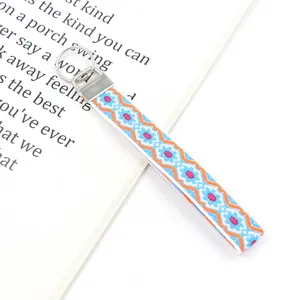 Detail view of Bohemian embroidered wristlet keychain with colorful ethnic geometric patterns