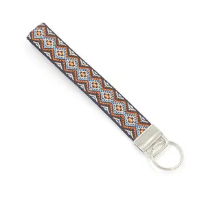 Bohemian embroidered wristlet keychain with colorful geometric pattern and metal clasp