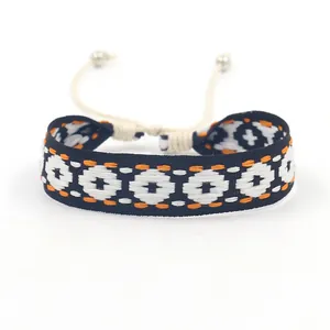 Bohemian geometric jacquard woven bracelet with adjustable cord and metallic beads
