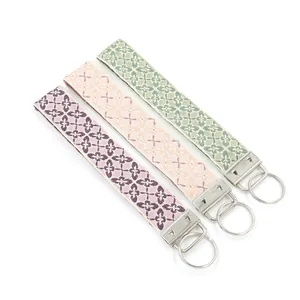 Ethnic embroidered wristlet keychains with floral weaving and silver metal rings