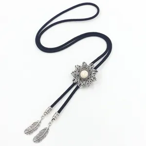 Western Bolo tie with silver flame slide, white turquoise stone and feather pendants