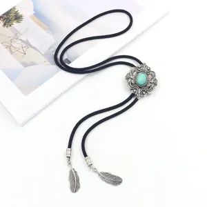 Vintage Bolo Tie met turquoise middenstuk en zilveren veren aan zwart koord