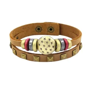 Detailed view of multilayer leather bracelet featuring bronze alloy star disc and snap closure