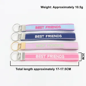 Detail showing Best Friends jacquard woven wristlet keychain in four colors with dimensions