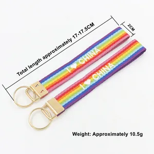 Llavero de pulsera tejida arcoíris con bordado y cierre de metal dorado, de 17cm de longitud