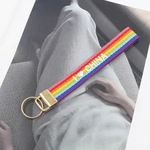 Detail of rainbow woven lanyard with gold metal clip and I Love China embroidery