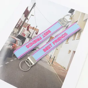 Set of 2 Best Friends embroidered blue wristlet keychains with pink lettering