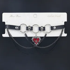 Punk leather choker with red heart pendant, skull charms and layered metal chains