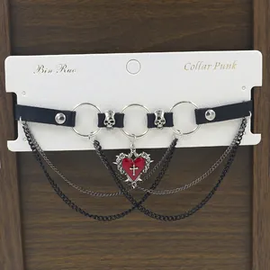 Punk leather choker with layered chains and red cross heart pendant on display card