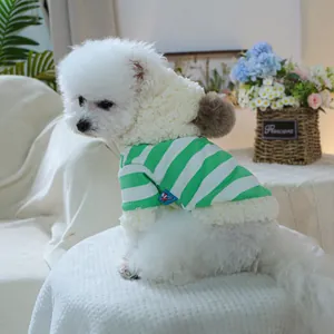 Detail of green and white striped pet hoodie with fleece lining and soft brown pompom