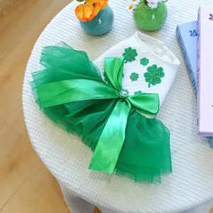 Detail of St. Patrick's Day pet dress with shamrock embroidery and green tulle skirt