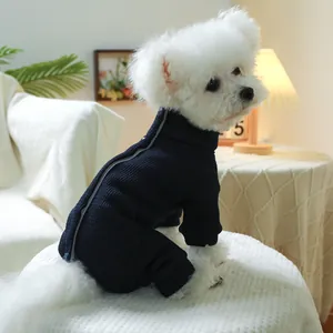 Detail of navy ribbed pet jumpsuit with back zipper on a small white dog
