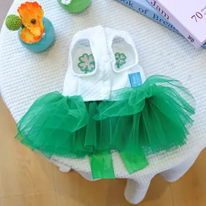 Detail of pet dress with clover embroidery and multi-layer green mesh tulle skirt