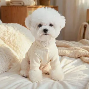 Cream knit dog cardigan for small pets featuring a button closure and ribbed texture
