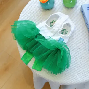 Detail view of St. Patrick's Day pet dress with clover embroidery and green mesh skirt