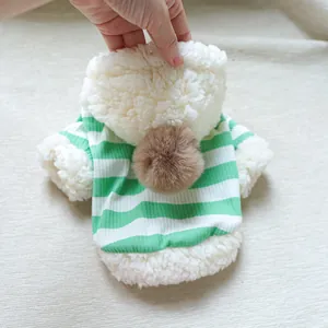 Detail of green and white striped pet hoodie with soft plush trim and a brown pom-pom