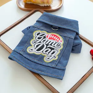 Close-up of pet denim jacket with Game Day embroidery and metal D-ring attachment