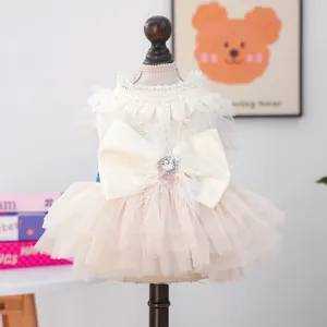 Elegant off-white pet lace wedding dress with large satin bow and feather details