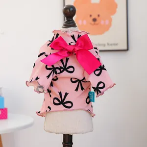Pink dog sweater with large magenta bow and ribbon patterns for small pets