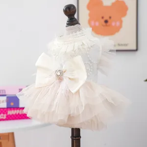 Elegant off-white lace pet wedding dress with a large bow and ruffled mesh skirt for small dogs