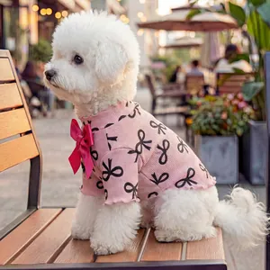 Pink pet knit sweater for small dogs with bow tie patterns and satin ribbon decor