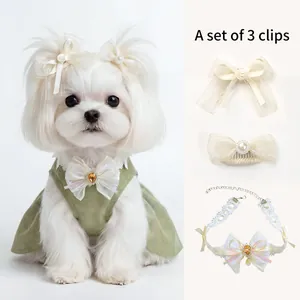 Three-piece pet accessory set with lace collar, pearl bow clips, and yellow gemstone pendant