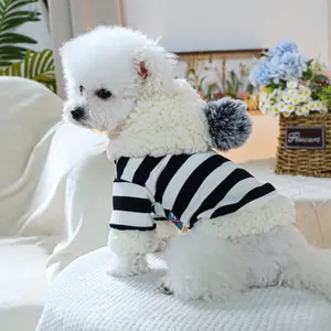 Detail of pet striped hoodie showing soft sherpa lining and fuzzy pom-pom on the hood
