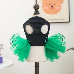 Close-up of pet dress featuring black ribbed top and layered green mesh tutu skirt