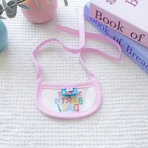 Detail of pink striped pet birthday bib with rainbow Happy Birthday embroidery and size S label