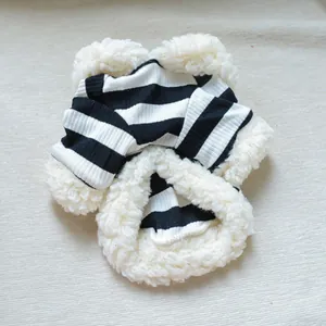Detail of striped pet hoodie with fleece trim and elastic ribbed knit fabric