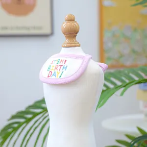 Close-up of pink striped birthday pet bandana with colorful 'IT'S MY BIRTHDAY' embroidery