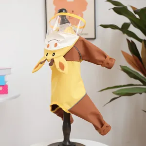 Detail of yellow giraffe pet raincoat with a transparent hood and elastic cuffs