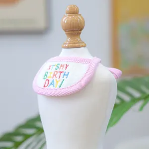 Close-up of pet birthday bandana with It's My Birthday embroidery and pink striped edge