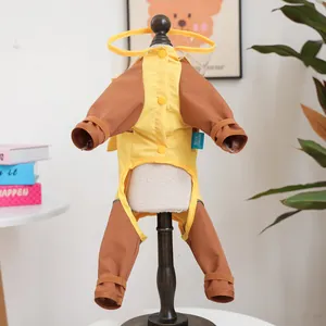 Detail of waterproof pet raincoat with transparent PVC hood and snap buttons on a stand