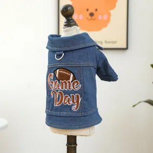 Detail of dark blue pet denim jacket featuring Game Day embroidery and metal D-ring for leash