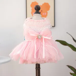 Pink pet wedding dress with lace floral embroidery, satin bow, and layered tulle skirt