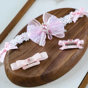 Pink Lolita style pet hair accessory set with lace bows and pearl gemstone details
