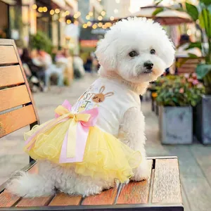 Easter pet dress featuring a white vest with rabbit print and yellow mesh tutu skirt