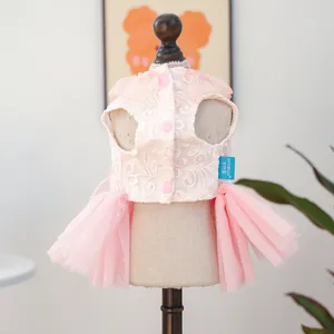 Detail of pink floral lace pet wedding dress with multi-layer dot mesh skirt for small dogs